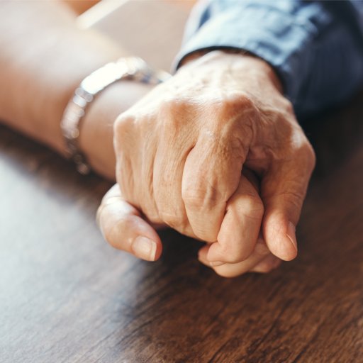 Marriage senior couple holding hands in for support, mental health and care after bad news, results.