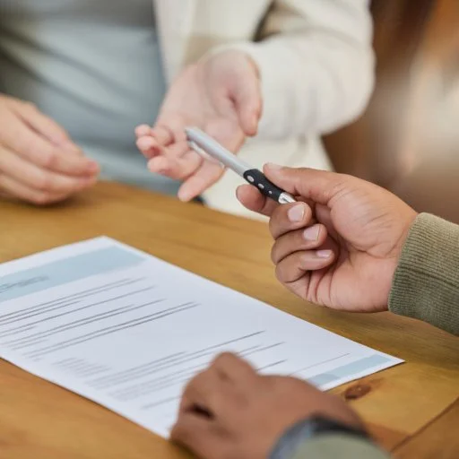 Business, hands and contract with pen for signature, recruitment or hiring form on office desk. Han.